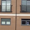 Aluminium windows and painted hardwood doors