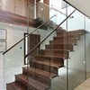 Contemporary walnut and glass staircase