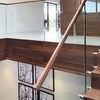 Modern walnut stairs with glass balustrade